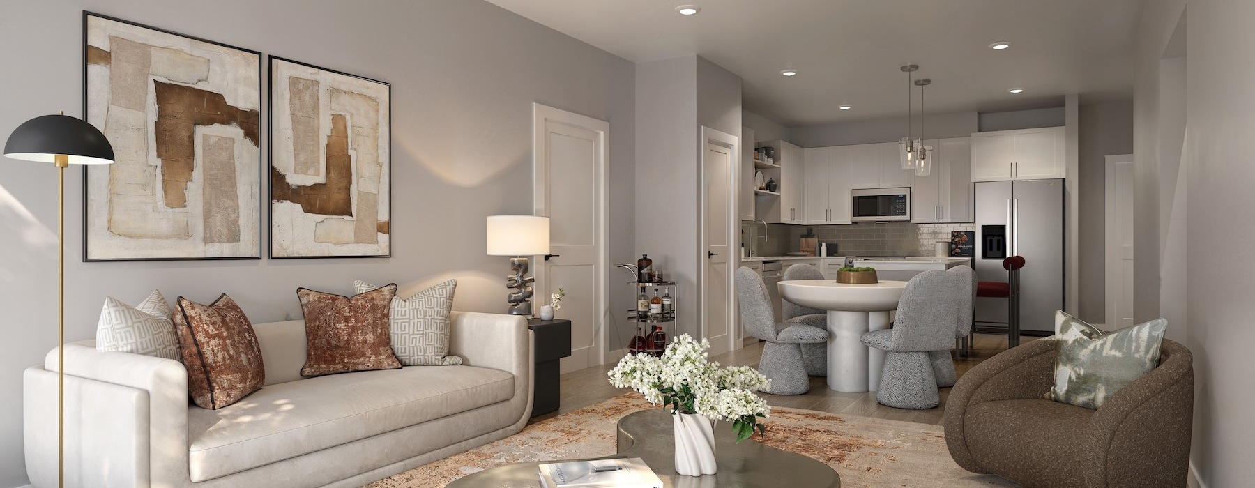 living room with seating and large pieces of art on the wall