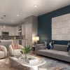 living room with seating and large piece of art on the wall