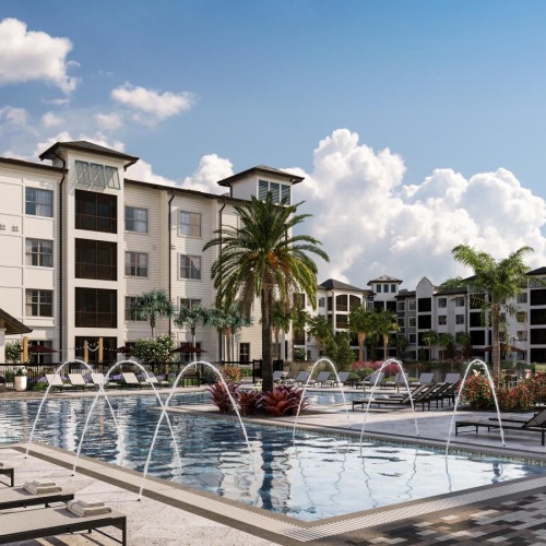 a large building with a pool in front of it